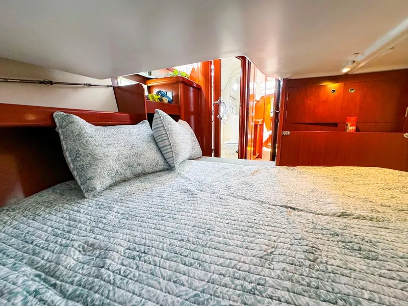 Slide: The Image of Cozy cabin interior of 2005 Beneteau 423 sailboat with comfortable bedding. - 20