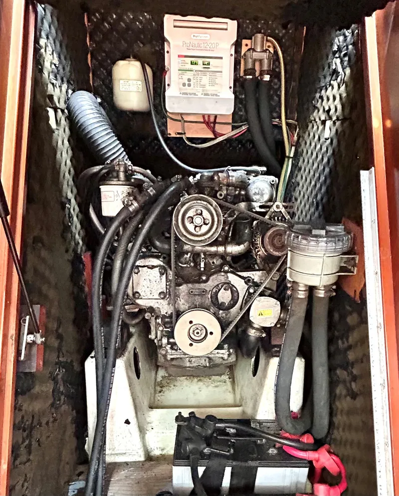Slide: The Image of Engine compartment of a 2005 Beneteau 423 sailboat, showcasing mechanical components. - 25