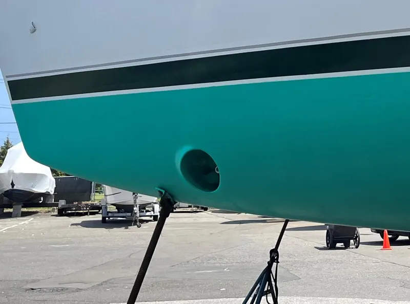 Slide: The Image of Beneteau 423 sailboat hull, 2005 model, turquoise color, on dry dock. - 29