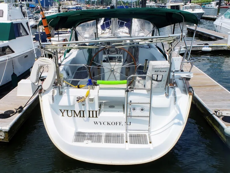 Slide: The Image of 2005 Beneteau 423 sailboat docked, rear view, named "Yumi III" in Wyckoff, NJ. - 4