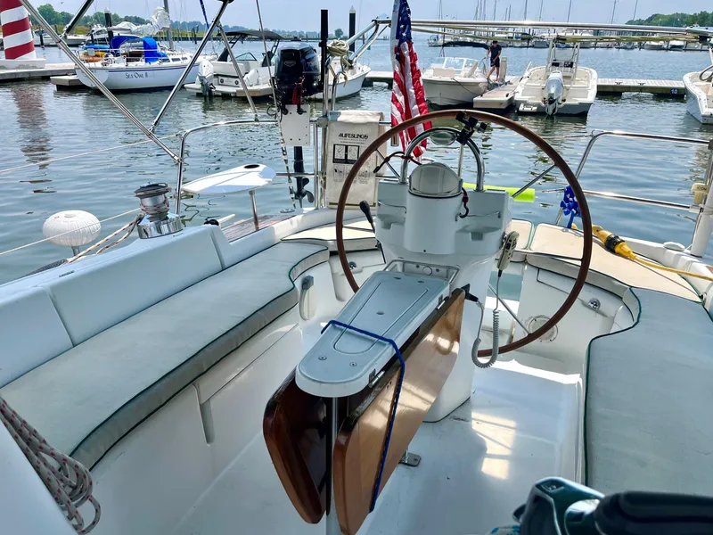 Slide: The Image of 2005 Beneteau 423 sailboat cockpit with wheel, docked at marina. - 6