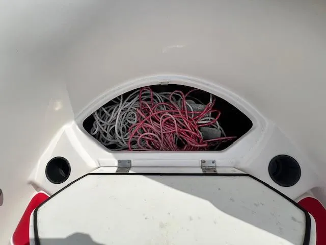 Slide: The Image of Storage compartment with ropes on a 2004 Yamaha Boats AR 210. - 12
