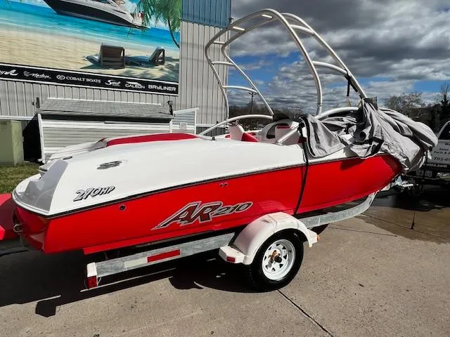 Slide: The Image of 2004 Yamaha Boats AR 210 red and white speedboat on trailer. - 4