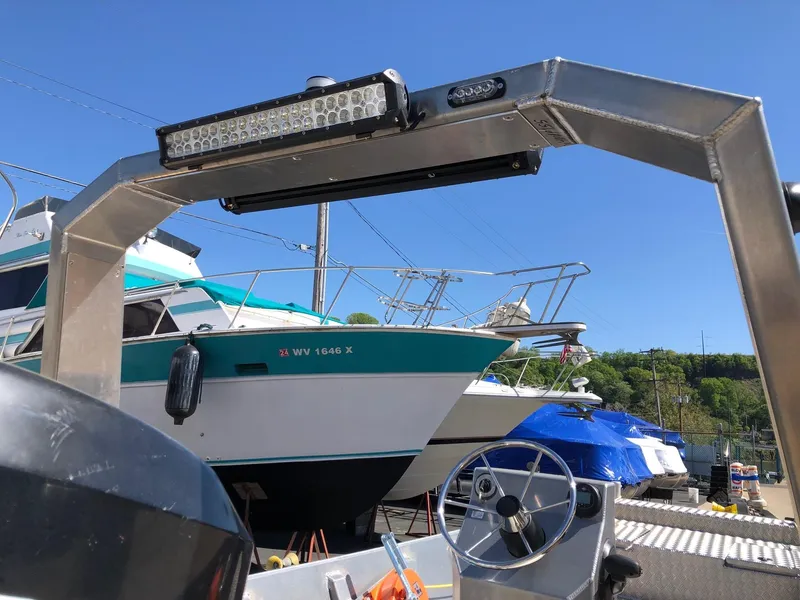 Slide: The Image of 2023 HasCraft 500 All Around boat in marina with other boats. - 3