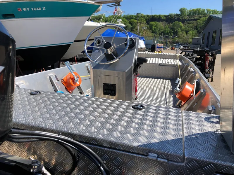 Slide: The Image of 2023 HasCraft 500 All Around boat with aluminum deck and steering console. - 4