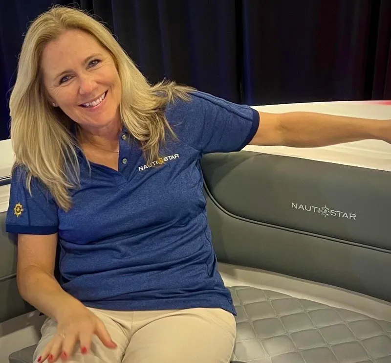 Slide: The Image of Smiling woman on 2024 NauticStar 193SC Sport Deck boat seat. - 24