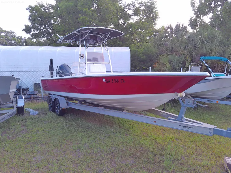 Slide: The Image of 2008 Clearwater 2400 Baystar Bay Boat in red on a trailer. - 1