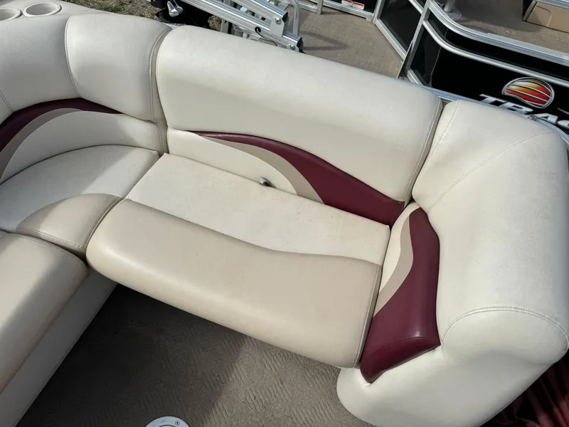 Slide: The Image of 2011 Sun Tracker Party Barge 21 seating with beige and maroon upholstery. - 16