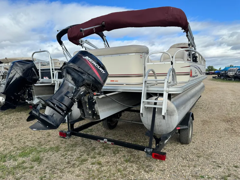 Slide: The Image of 2011 Sun Tracker Party Barge 21 pontoon boat with Mercury outboard motor on trailer. - 3