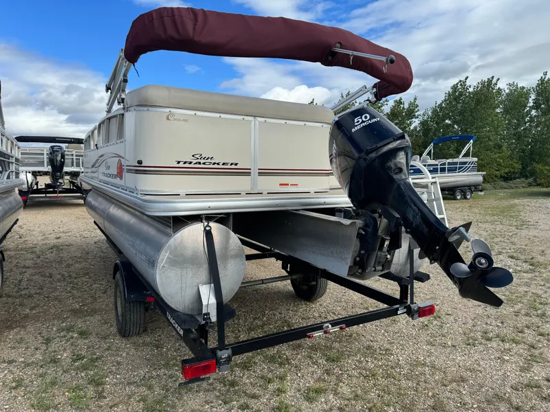 Slide: The Image of 2011 Sun Tracker Party Barge 21 pontoon boat with outboard motor on trailer. - 4