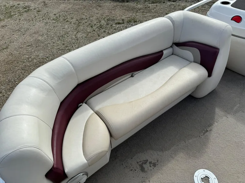 Slide: The Image of 2011 Sun Tracker Party Barge 21 seating with beige and maroon upholstery. - 7