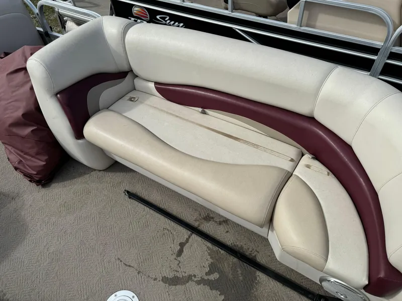 Slide: The Image of 2011 Sun Tracker Party Barge 21 seating with beige and maroon upholstery. - 9