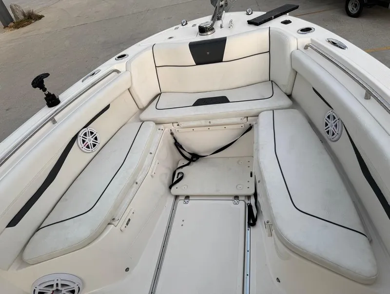 Slide: The Image of 2019 Wellcraft 262 Fisherman boat interior with white seating and black accents. - 18