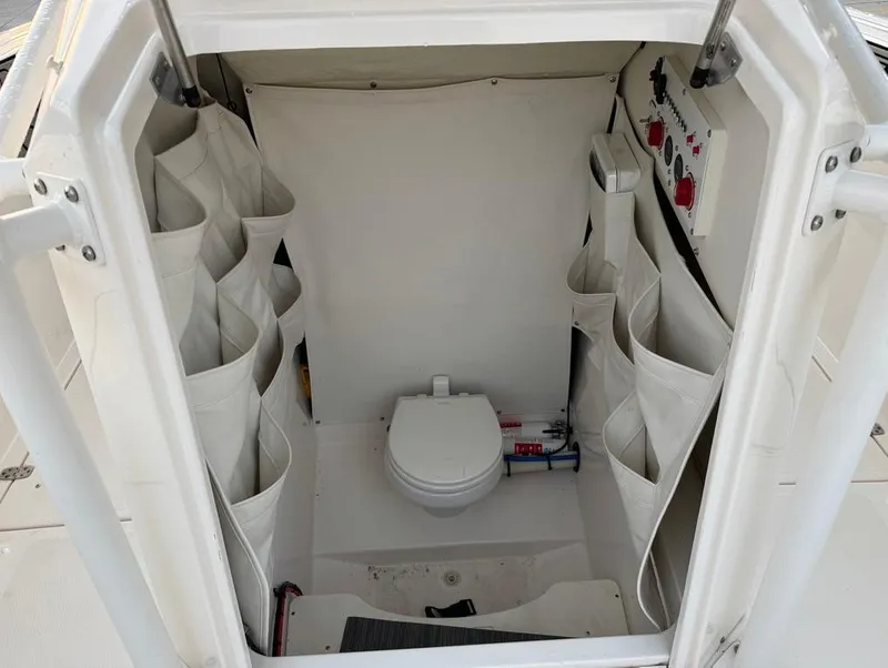 Slide: The Image of Interior of 2019 Wellcraft 262 Fisherman boat with storage and toilet. - 20