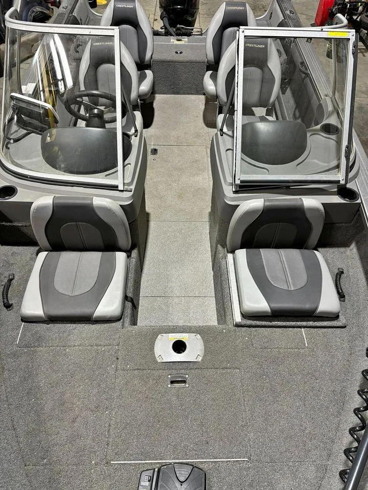 Slide: The Image of 2016 Crestliner 1750 Super Hawk interior with seating and windshield. - 4