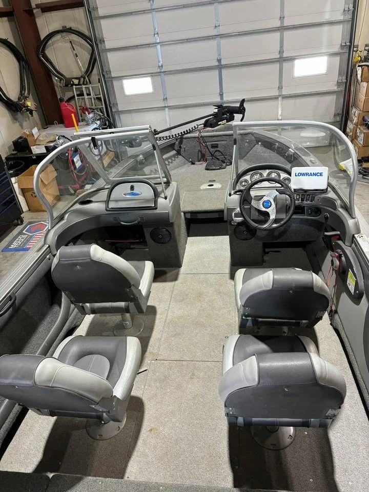 Slide: The Image of 2016 Crestliner 1750 Super Hawk boat interior with four seats and steering console. - 5