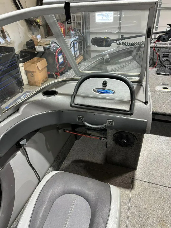 Slide: The Image of 2016 Crestliner 1750 Super Hawk boat interior with steering console and seating. - 8