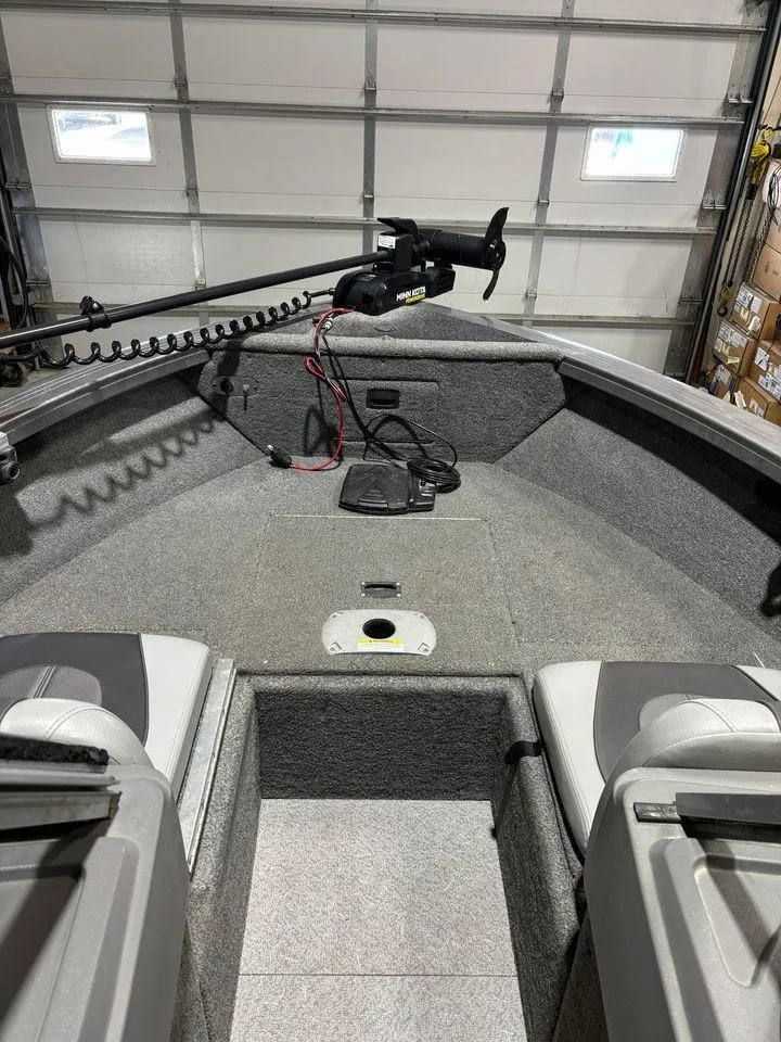 Slide: The Image of 2016 Crestliner 1750 Super Hawk boat interior with trolling motor in garage. - 9