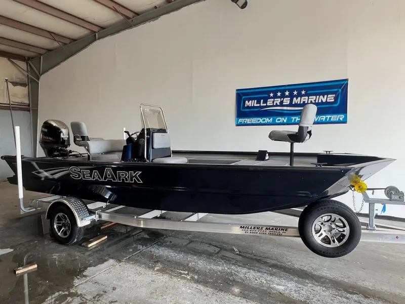 Slide: The Image of 2024 SeaArk 2072 FXT boat on trailer at Miller's Marine showroom. - 2