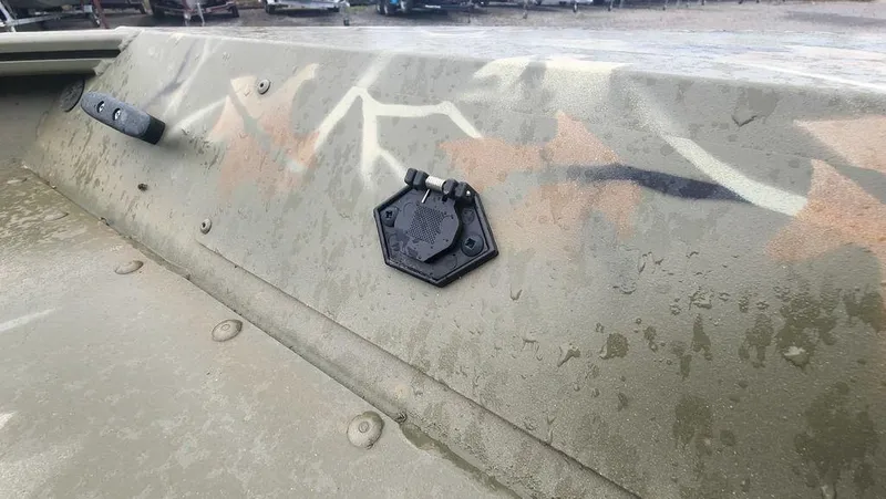 Slide: The Image of 2025 Tracker GRIZZLY® 1754 SC boat with camouflage pattern and water droplets. - 16