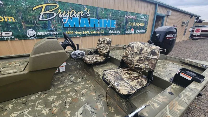 Slide: The Image of 2025 Tracker GRIZZLY® 1754 SC boat with camo seats at Bryan's Marine dealership. - 22