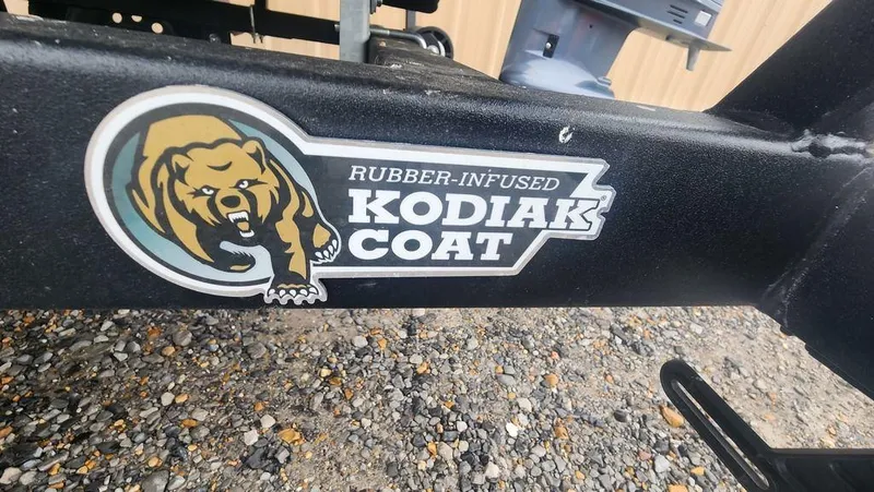 Slide: The Image of Sticker on 2025 Tracker GRIZZLY® 1754 SC with "Rubber-Infused Kodiak Coat" logo. - 25