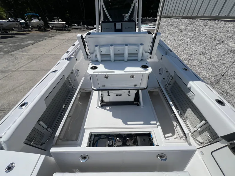 Slide: The Image of 2024 Blackfin 252 CC center console boat interior with seating and storage compartments. - 13