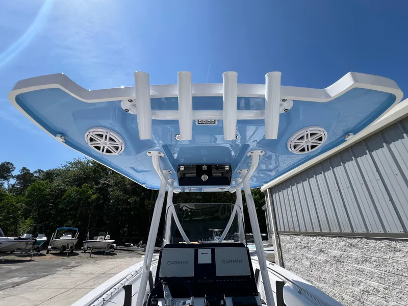 Slide: The Image of 2024 Blackfin 252 CC boat with blue T-top and Garmin electronics. - 17