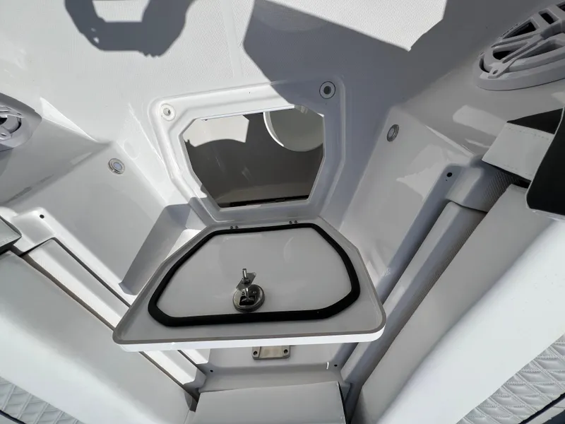 Slide: The Image of 2024 Blackfin 252 CC boat storage compartment with open hatch. - 24