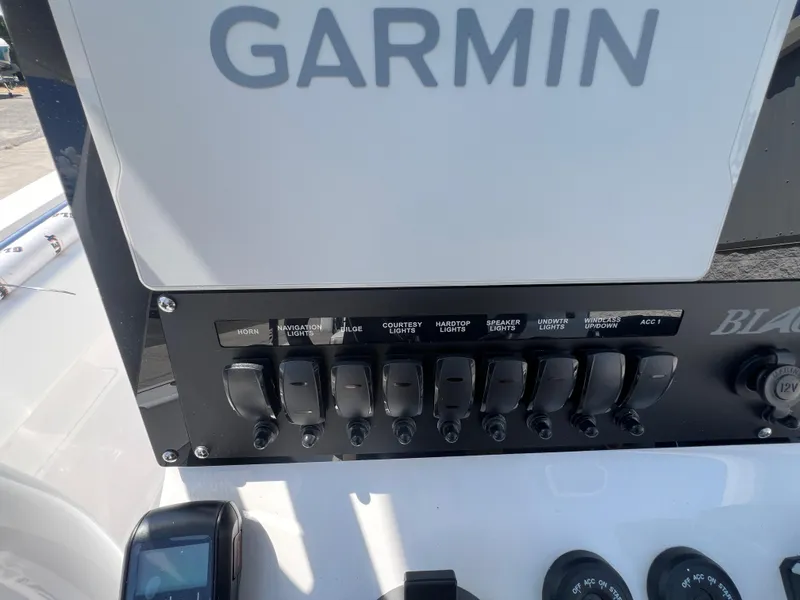 Slide: The Image of Control panel of 2024 Blackfin 252 CC boat with Garmin navigation system. - 28