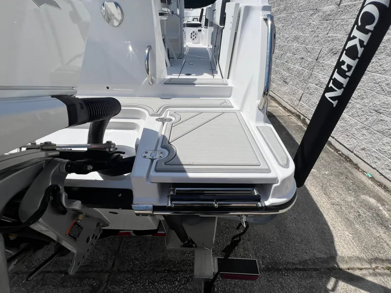Slide: The Image of 2024 Blackfin 252 CC boat stern with deck and equipment. - 30