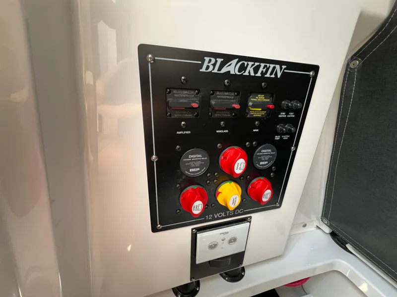 Slide: The Image of 2024 Blackfin 252 CC control panel with switches and circuit breakers. - 33
