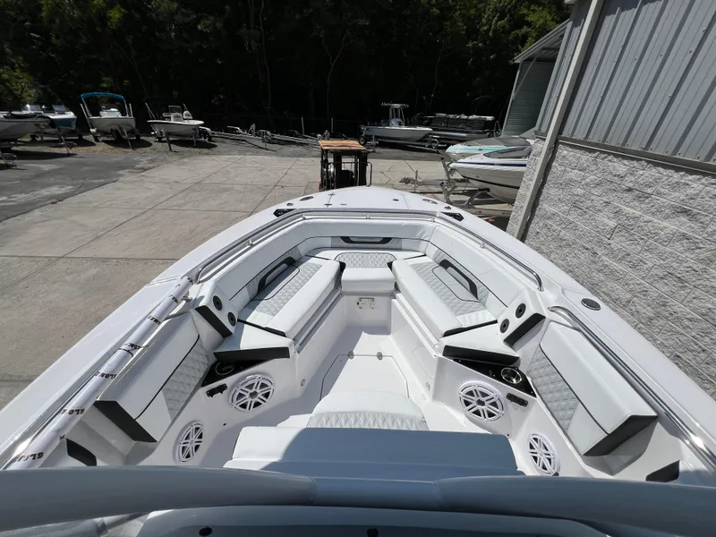 Slide: The Image of 2024 Blackfin 252 CC boat interior with seating and speakers. - 4