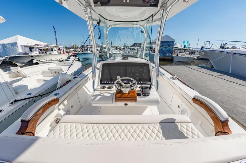 Slide: The Image of 2025 Valhalla Boatworks V-29 cockpit with modern controls and luxurious seating. - 13