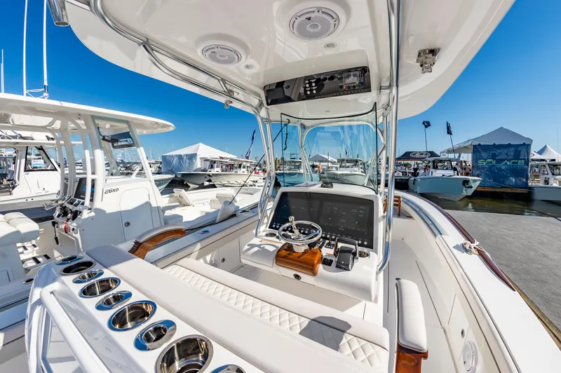 Slide: The Image of 2025 Valhalla Boatworks V-29 center console at a marina, showcasing modern design and features. - 14