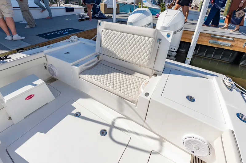 Slide: The Image of 2025 Valhalla Boatworks V-29 interior with cushioned seating and storage compartments. - 16