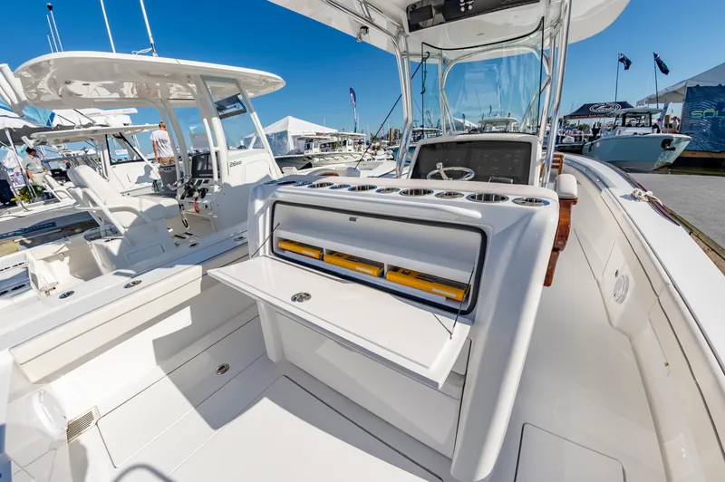 Slide: The Image of 2025 Valhalla Boatworks V-29 interior, showcasing sleek design and modern amenities at a boat show. - 18
