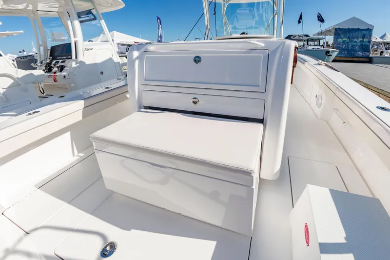 Slide: The Image of 2025 Valhalla Boatworks V-29 interior with seating and storage, docked at marina. - 20