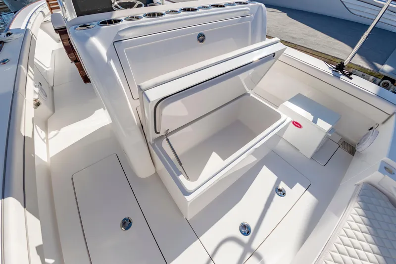 Slide: The Image of 2025 Valhalla Boatworks V-29 interior with open storage compartment, showcasing sleek design. - 21