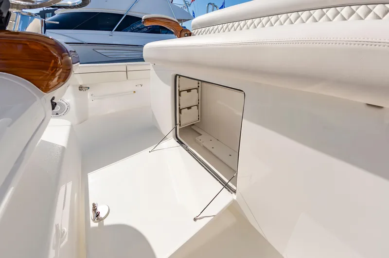 Slide: The Image of 2025 Valhalla Boatworks V-29 interior storage compartment, luxury design, white upholstery. - 24