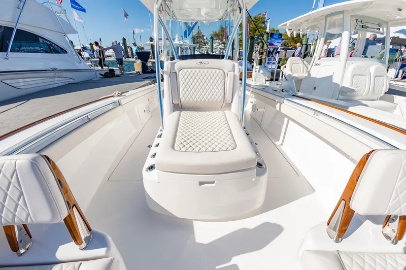 Slide: The Image of 2025 Valhalla Boatworks V-29 luxury interior with white seating and wood accents. - 29