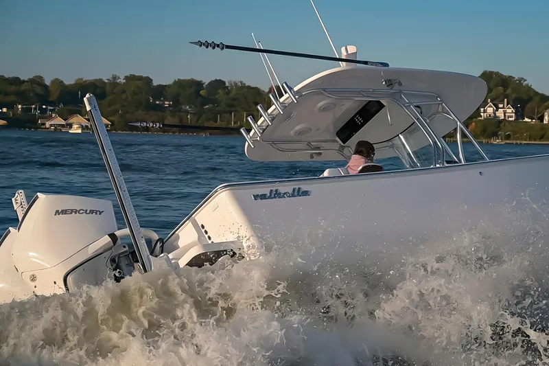 Slide: The Image of 2025 Valhalla Boatworks V-29 cruising on water with Mercury engine. - 3