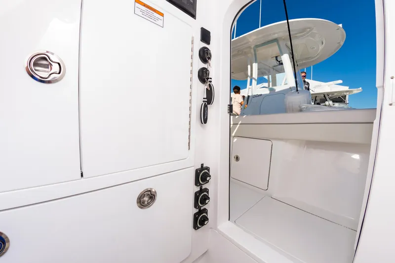 Slide: The Image of 2025 Valhalla Boatworks V-29 interior with sleek white design and control panel. - 35