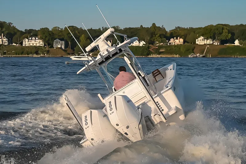 Slide: The Image of 2025 Valhalla Boatworks V-29 navigating through waves on a sunny day. - 4