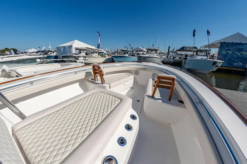 Slide: The Image of 2025 Valhalla Boatworks V-29 at marina, showcasing luxurious seating and sleek design. - 9