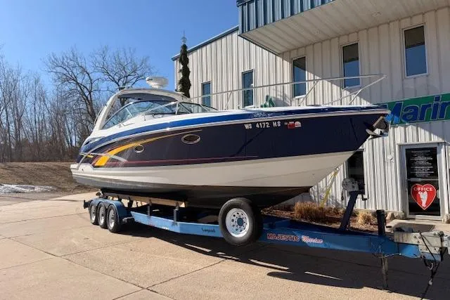 Slide: The Image of 2008 Formula 350 Sun Sport boat on trailer outside a building. - 1