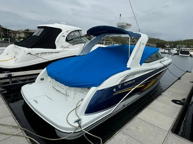 Slide: The Image of 2008 Formula 350 Sun Sport boat docked at marina. - 10