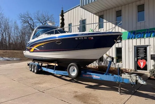 Slide: The Image of 2008 Formula 350 Sun Sport boat on trailer outside marine building. - 11