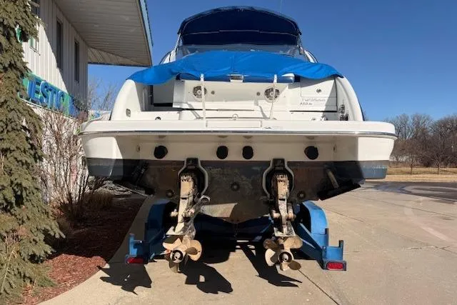Slide: The Image of 2008 Formula 350 Sun Sport boat on trailer, rear view with blue cover. - 13