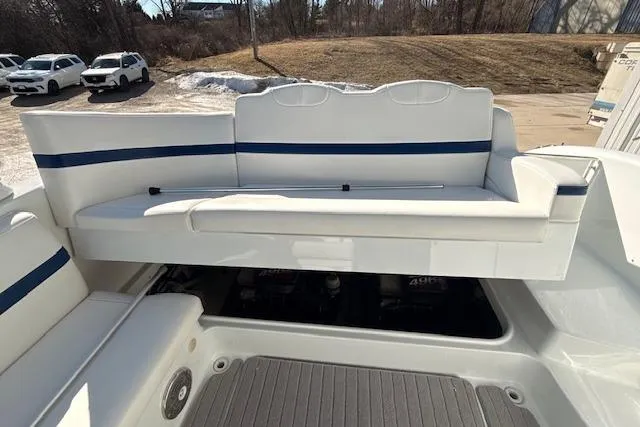 Slide: The Image of 2008 Formula 350 Sun Sport boat with white and blue seating, outdoor setting. - 14